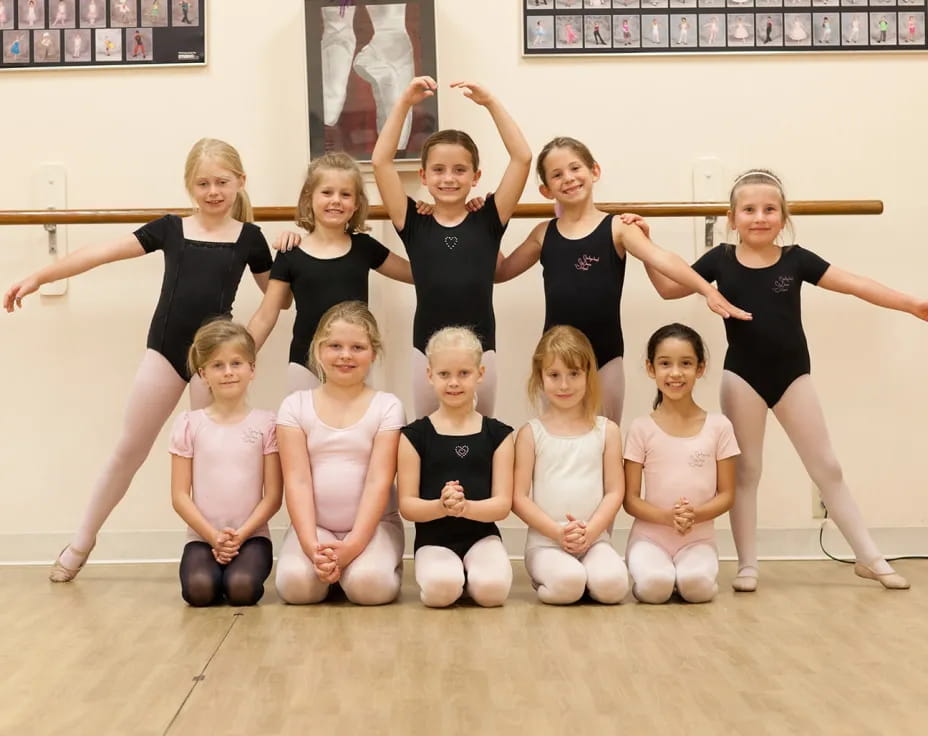 a group of girls posing for a photo