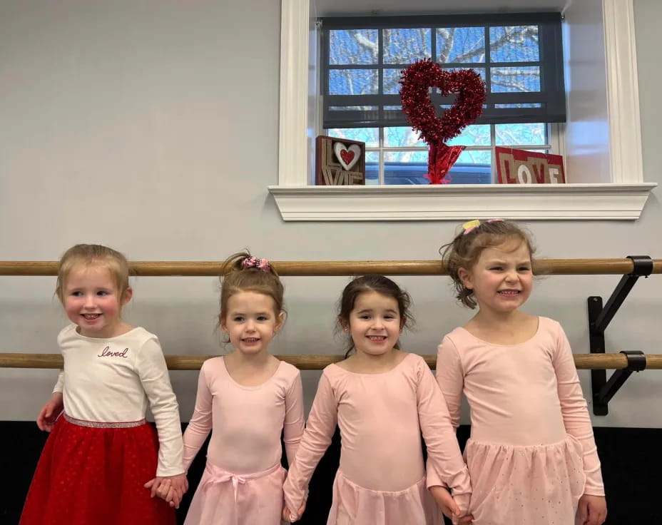 a group of girls in dresses