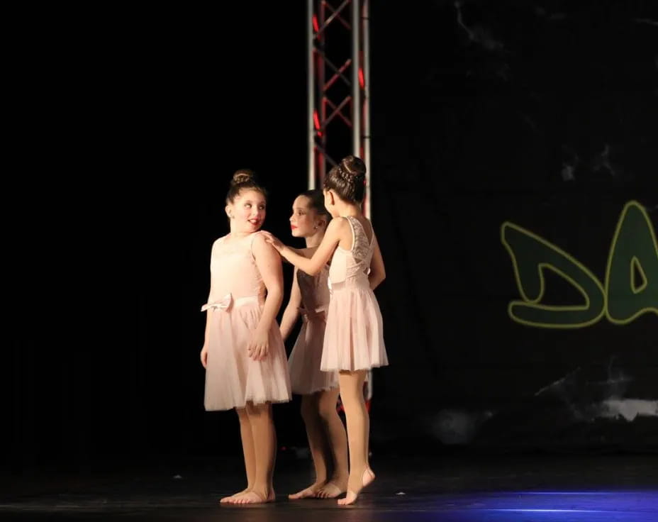 a group of girls on a stage