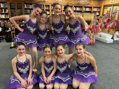 a group of women in dresses