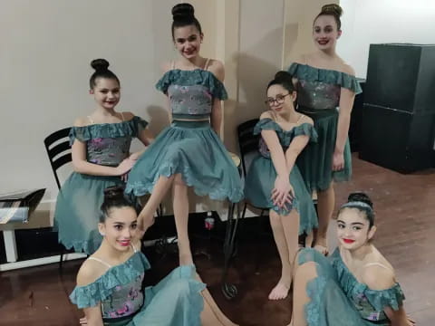 a group of women in dresses