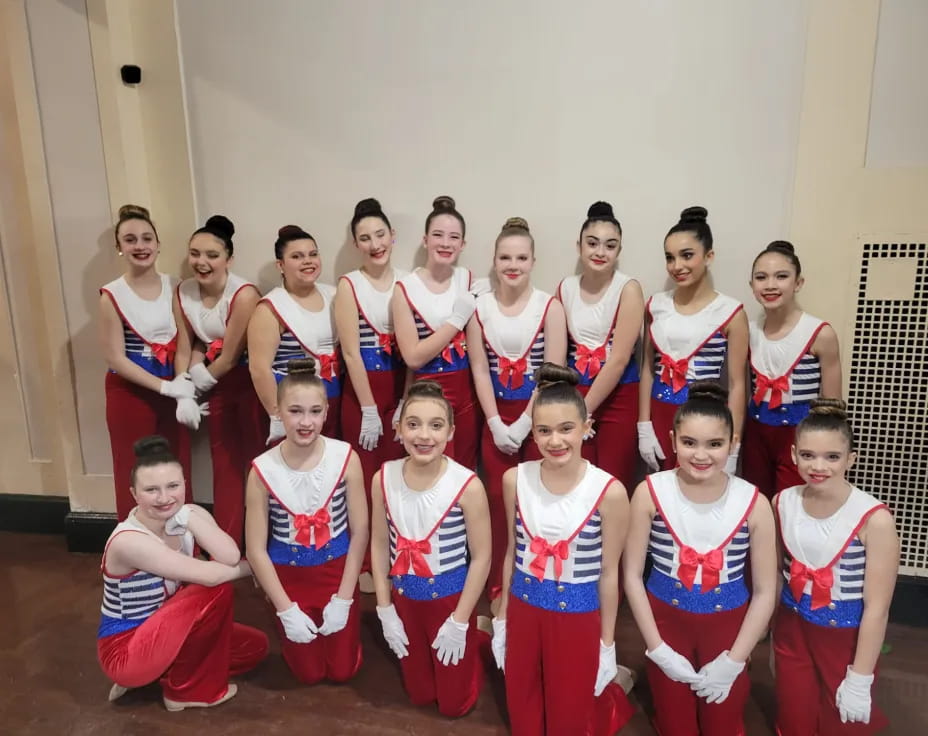 a group of women posing for a photo