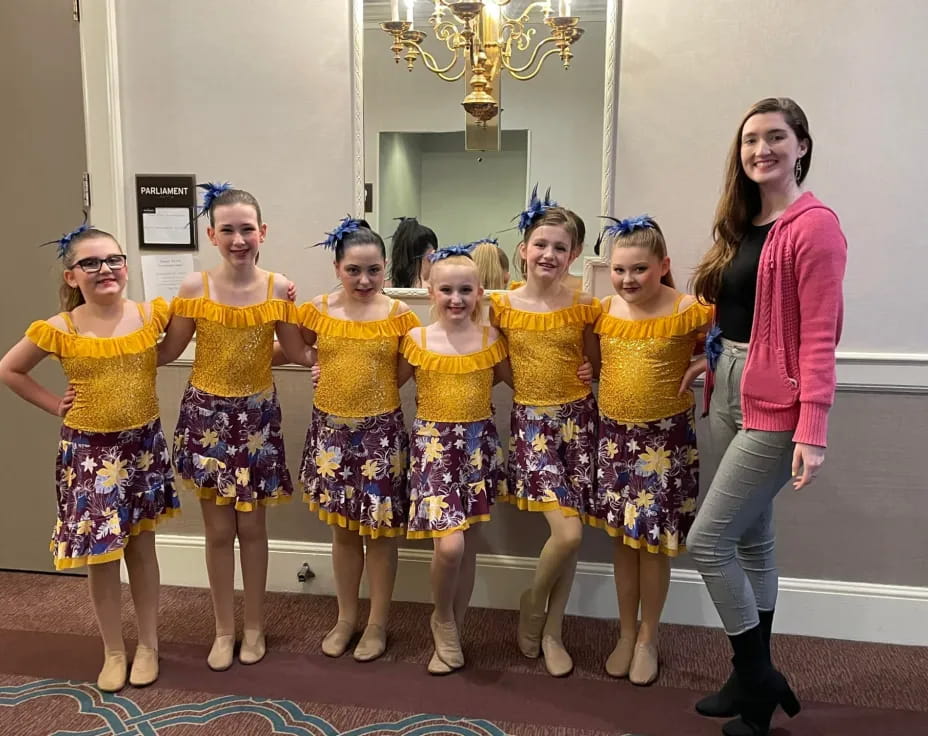 a group of girls posing for a photo