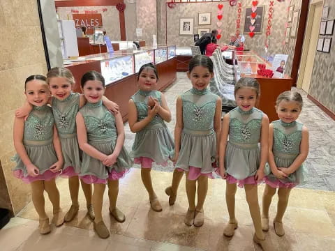 a group of children in dresses
