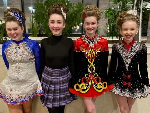 a group of girls in dresses