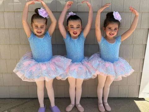 a group of girls in dresses