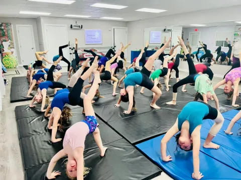 a group of people doing yoga
