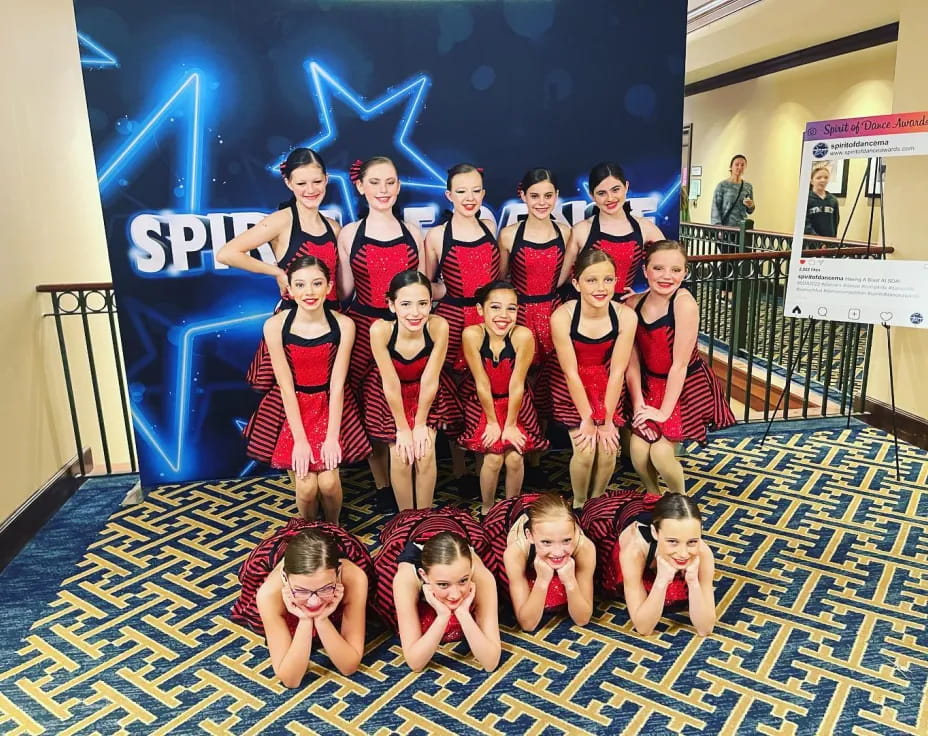 a group of girls posing for a photo