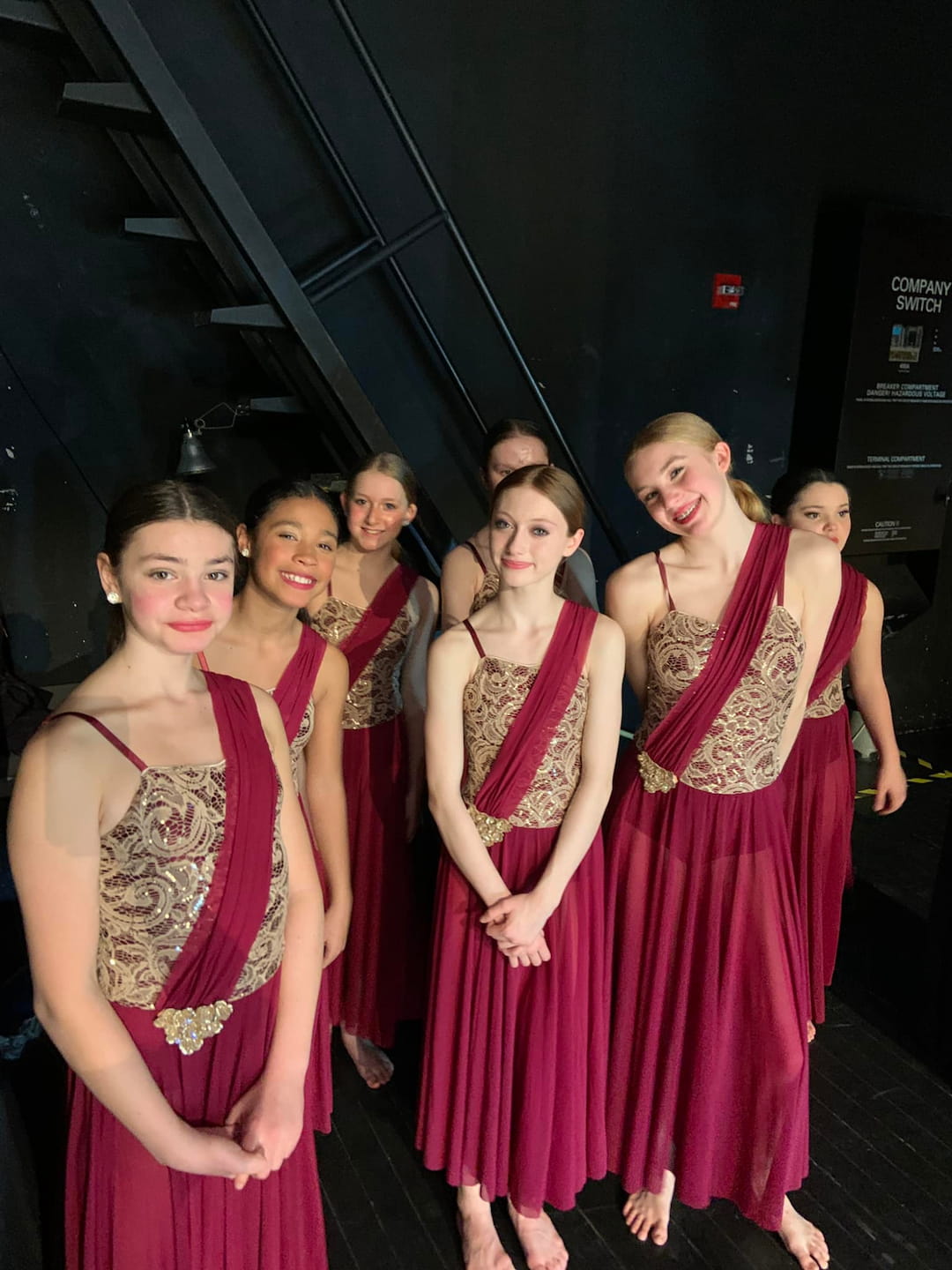 a group of women in dresses