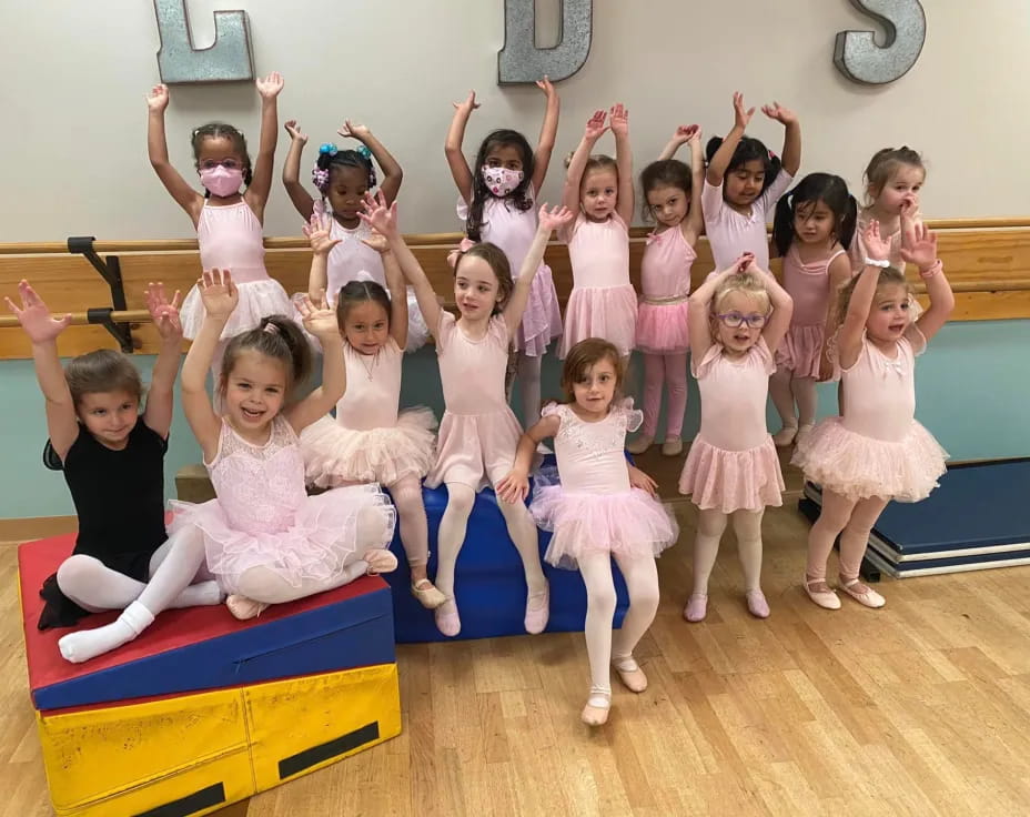 a group of girls posing for a photo