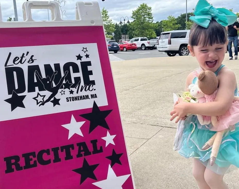 a child holding a baby