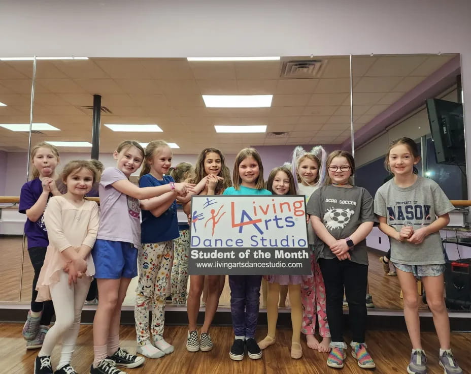 a group of people holding a sign