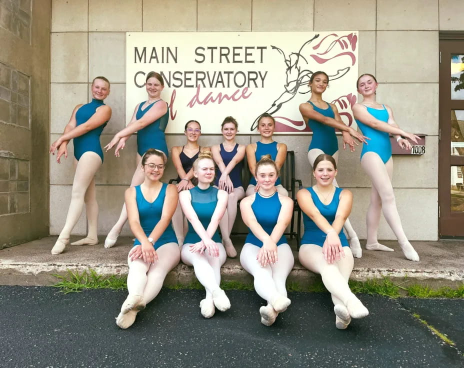 a group of women posing for a photo