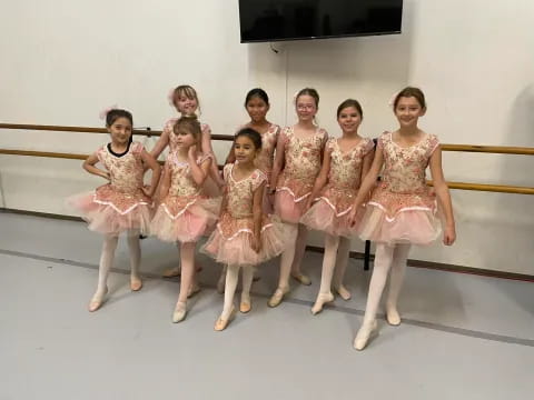 a group of girls in dresses