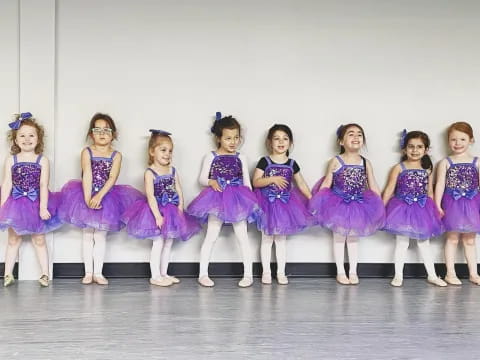 a group of girls in dresses
