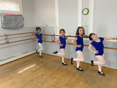 a group of girls in blue uniforms