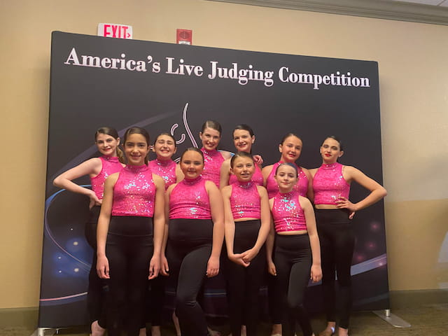 a group of women posing for a photo