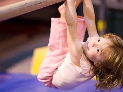 a woman doing a handstand