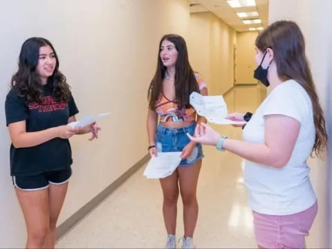 a group of women in a hallway