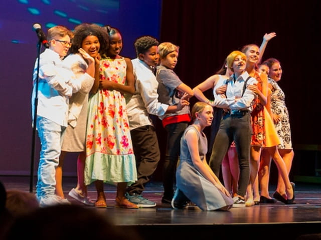 a group of people on a stage