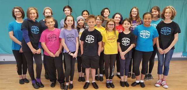 a group of people posing for a photo