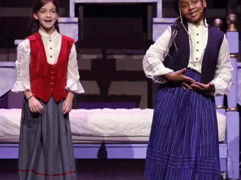 a couple of women on a stage