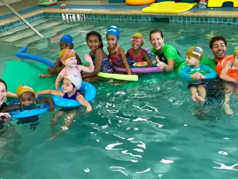 a group of kids in a pool