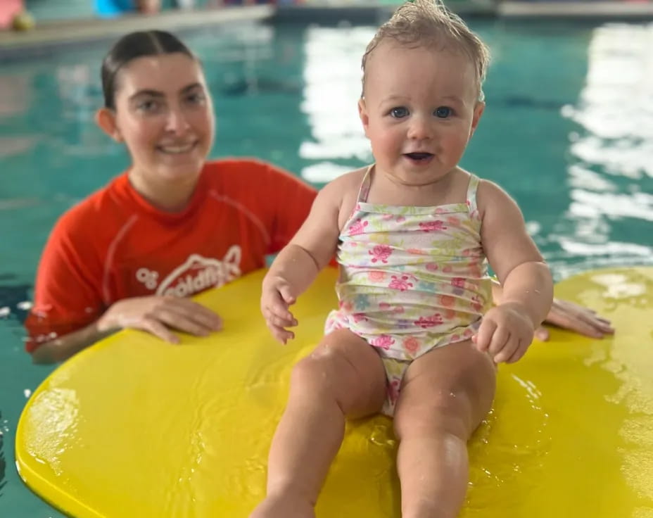 a couple of children in a pool