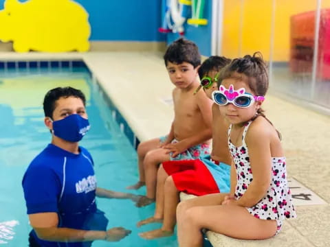 a group of kids in a pool