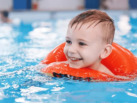 a boy in a pool