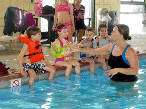 a group of children in a pool