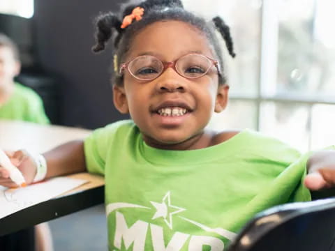 a young girl smiling