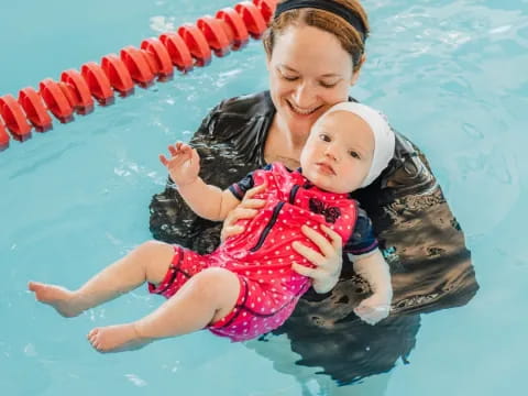 a person holding a baby