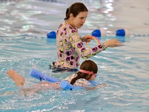 a person and a child in the water