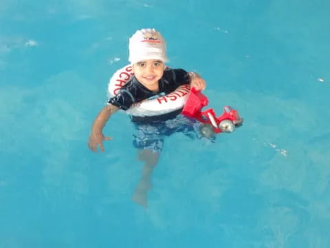 a boy in a pool