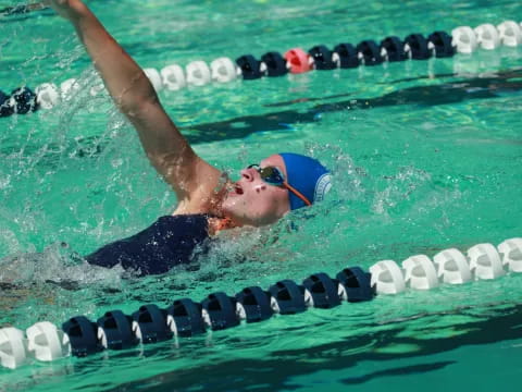 a person swimming in a pool