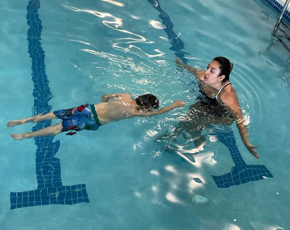 a man and woman in a pool