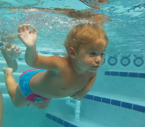 a child in a pool