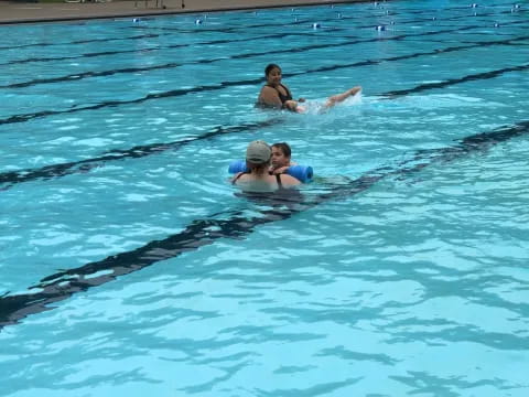 a group of people in a pool