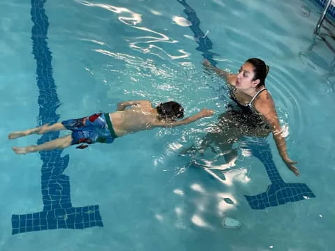a man and woman in a pool