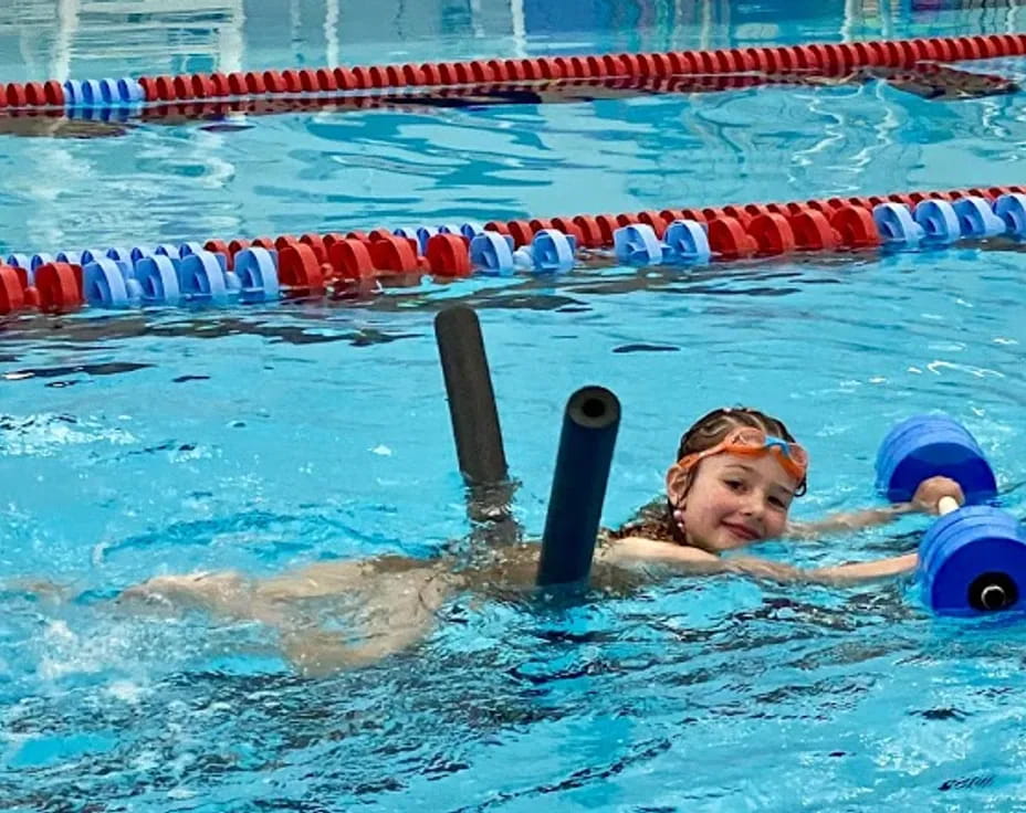 a person swimming in a pool