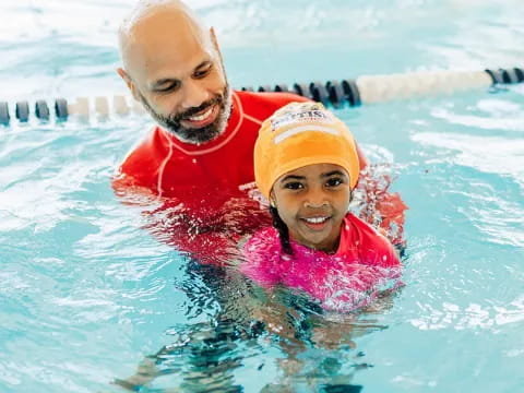 a man and woman in a pool