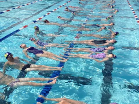 a group of people in a pool