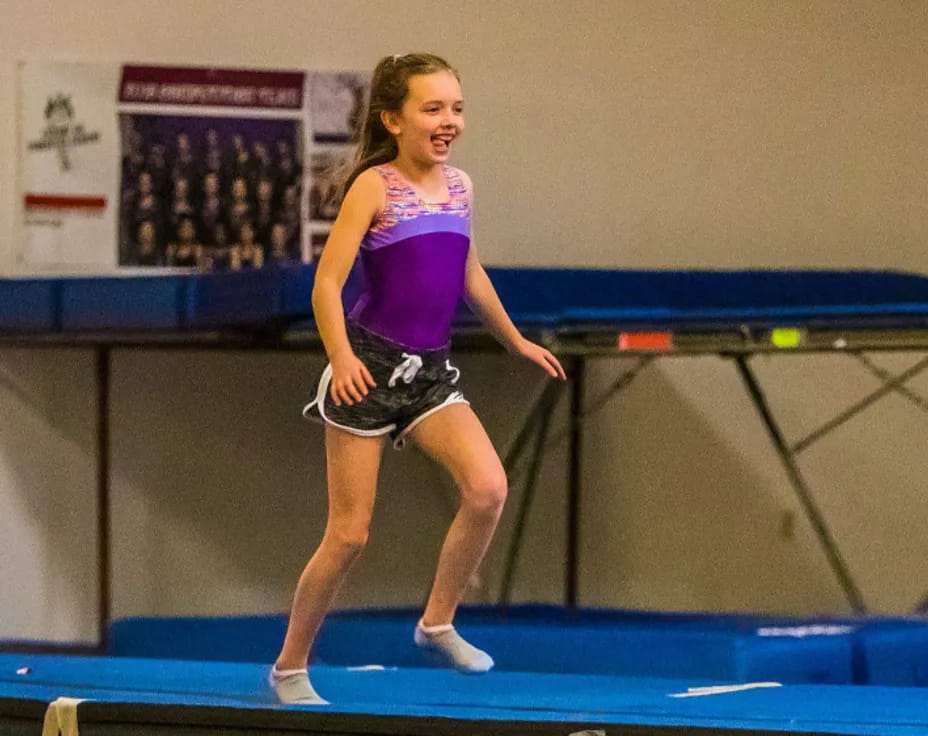 a woman playing ping pong