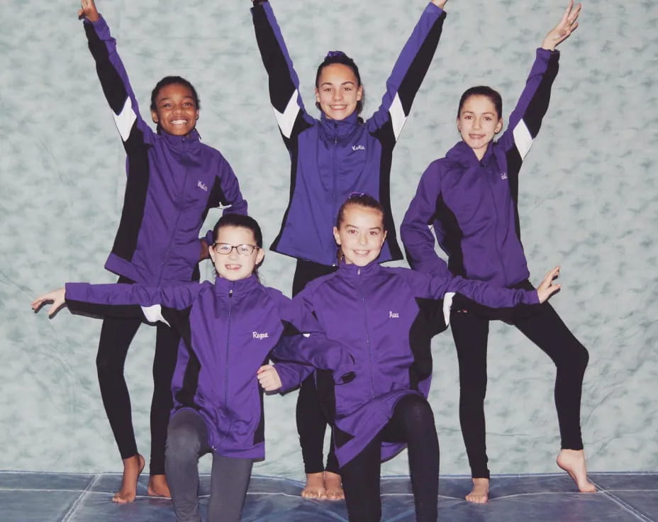 a group of people in purple