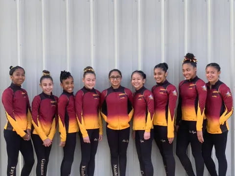 a group of people in red uniforms