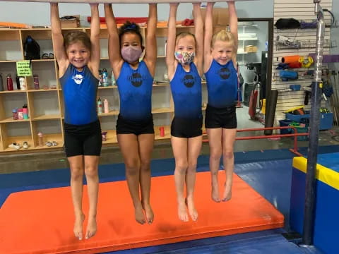 a group of women in blue shirts