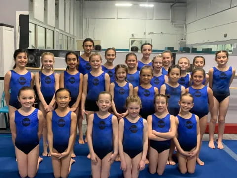 a group of women in blue uniforms