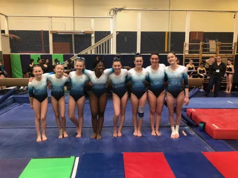 a group of women in blue uniforms