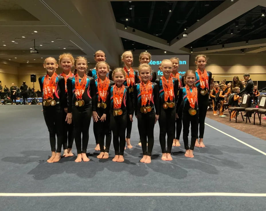 a group of people wearing medals